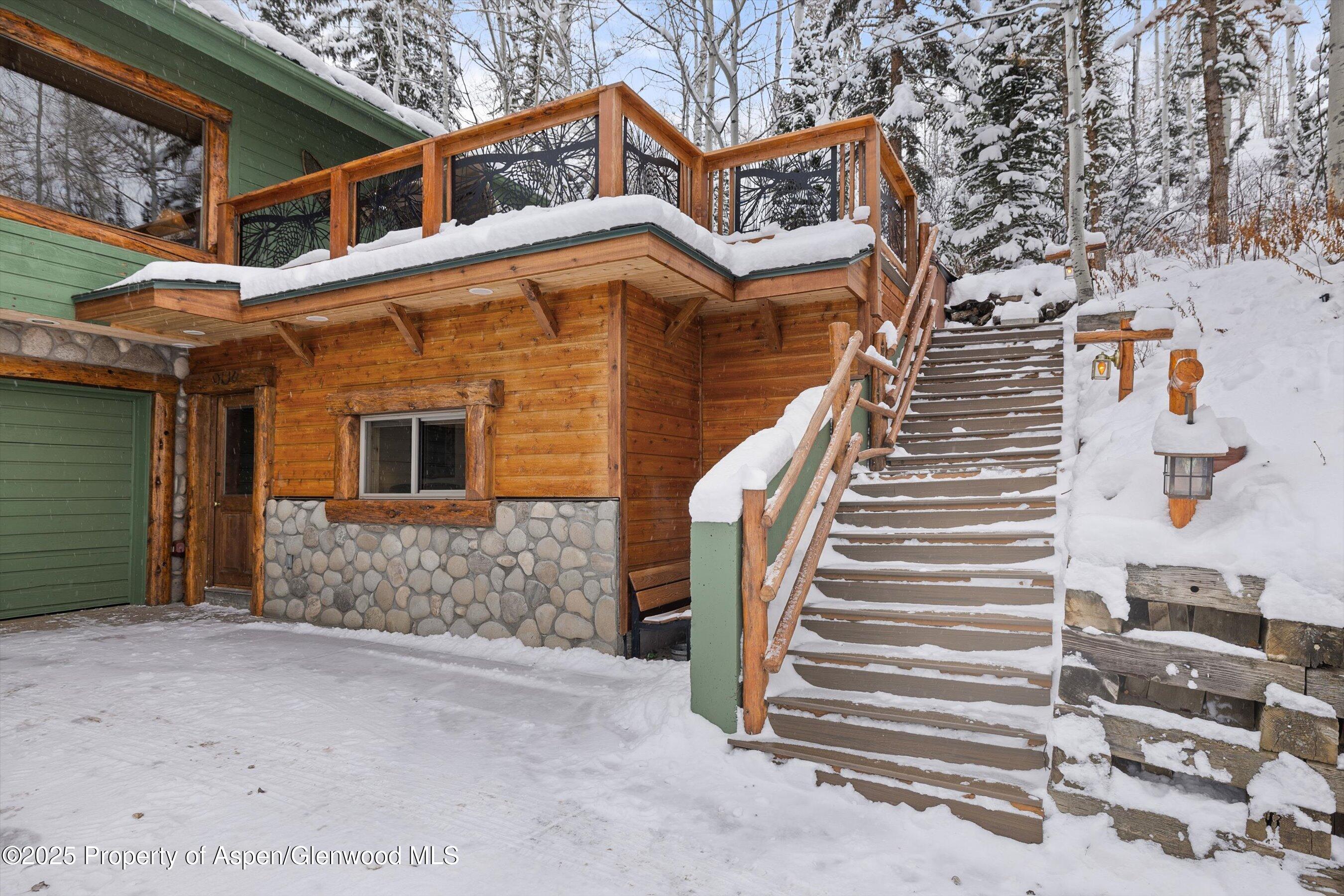 818 Faraway Road Snowmass Village, CO 81615 - Photo 23 of 24 a view of a house with a door and a balcony