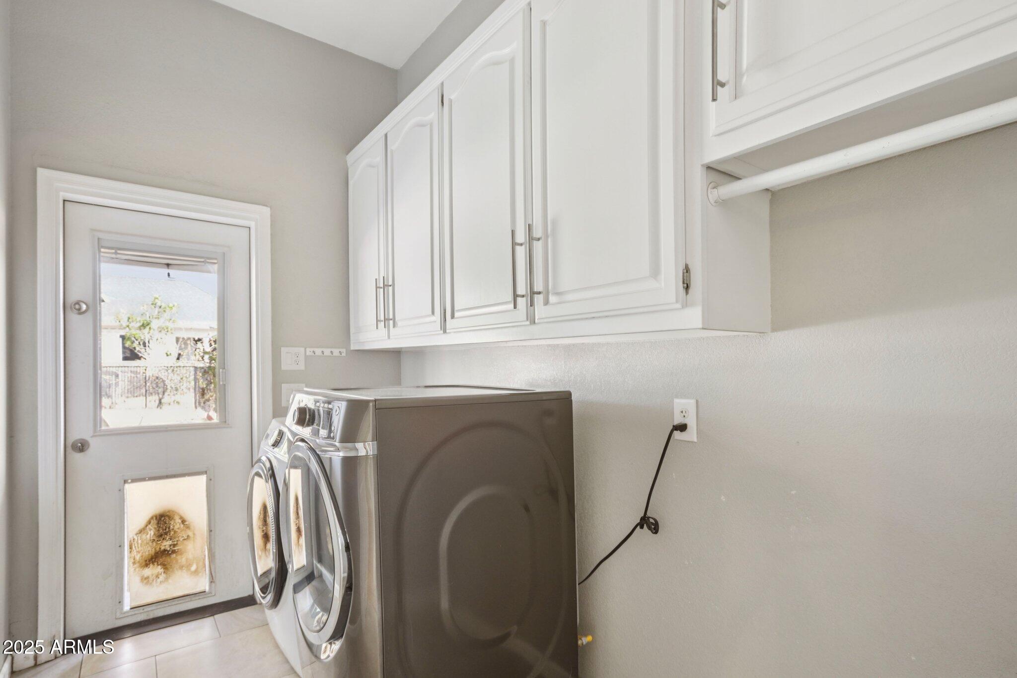 702 West Why Worry Lane Phoenix, AZ 85021 - Photo 16 of 46 a utility room with dryer and washer