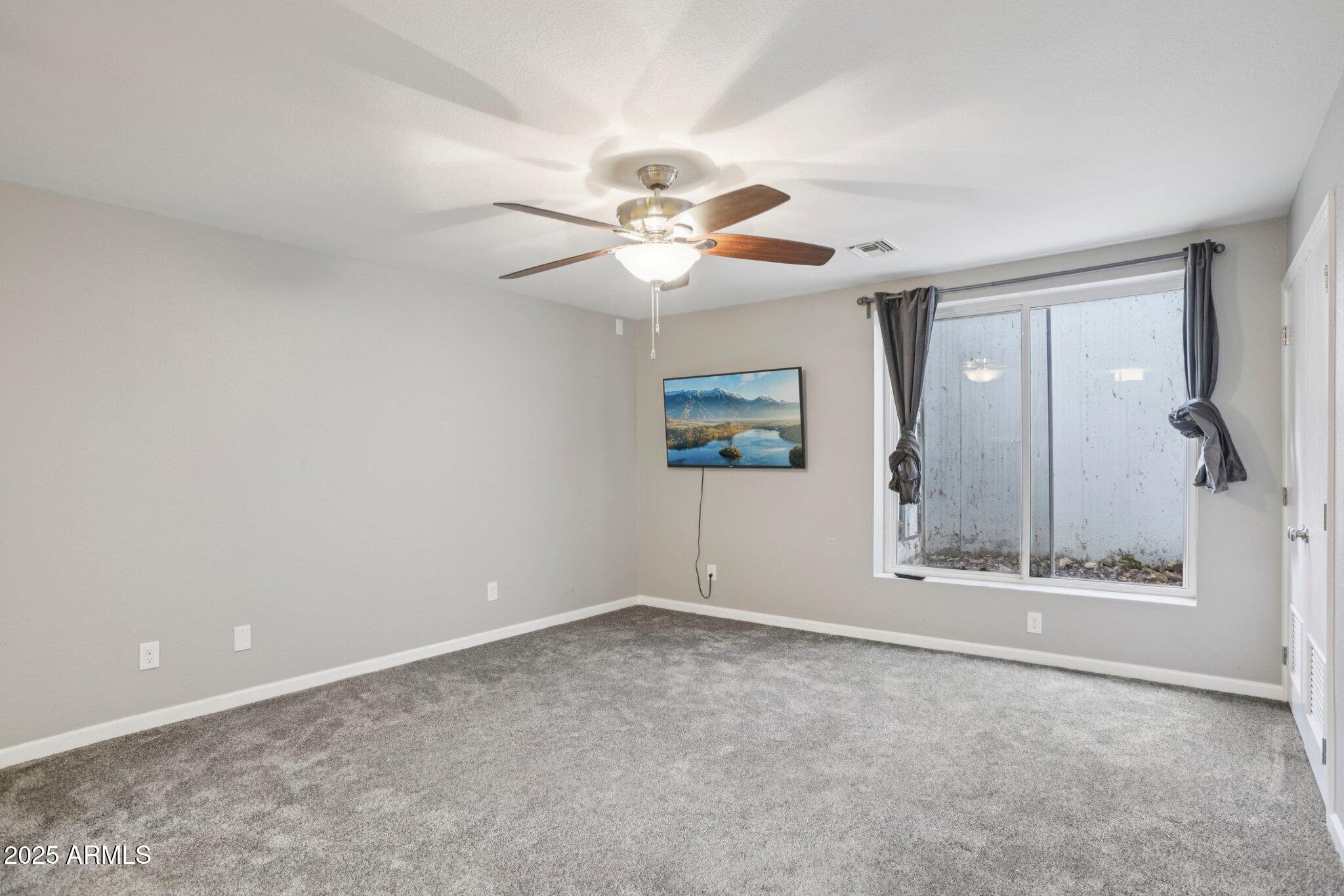 702 West Why Worry Lane Phoenix, AZ 85021 - Photo 26 of 46 a view of an empty room with a window