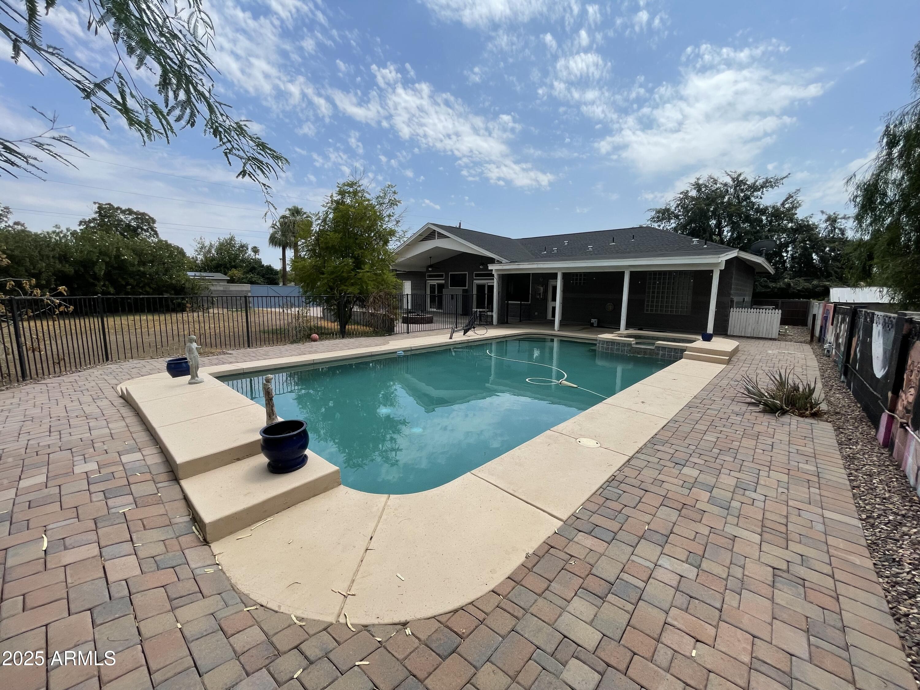 702 West Why Worry Lane Phoenix, AZ 85021 - Photo 38 of 46 a view of a house with a yard