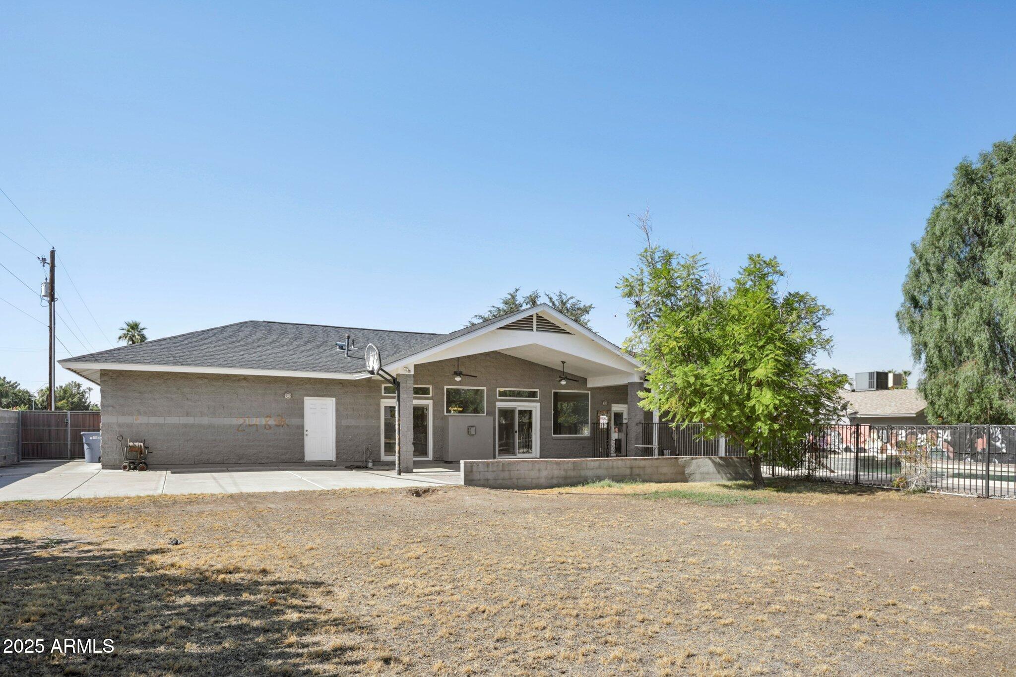 702 West Why Worry Lane Phoenix, AZ 85021 - Photo 42 of 46 a front view of a house with a yard and garage