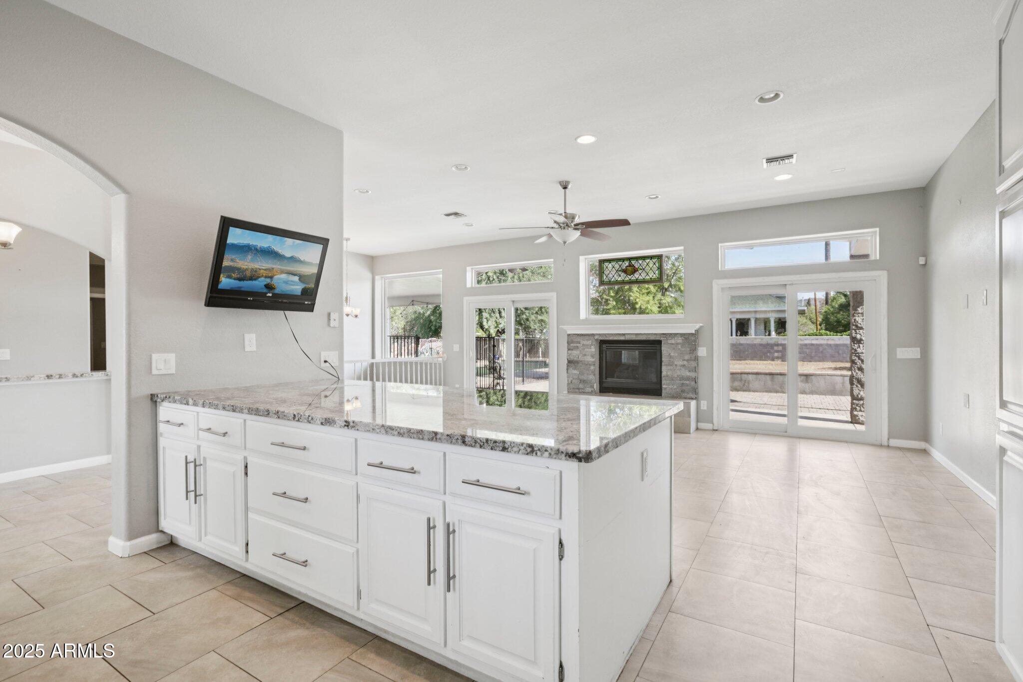 702 West Why Worry Lane Phoenix, AZ 85021 - Photo 6 of 46 a view of kitchen with stainless steel appliances granite countertop cabinets and window