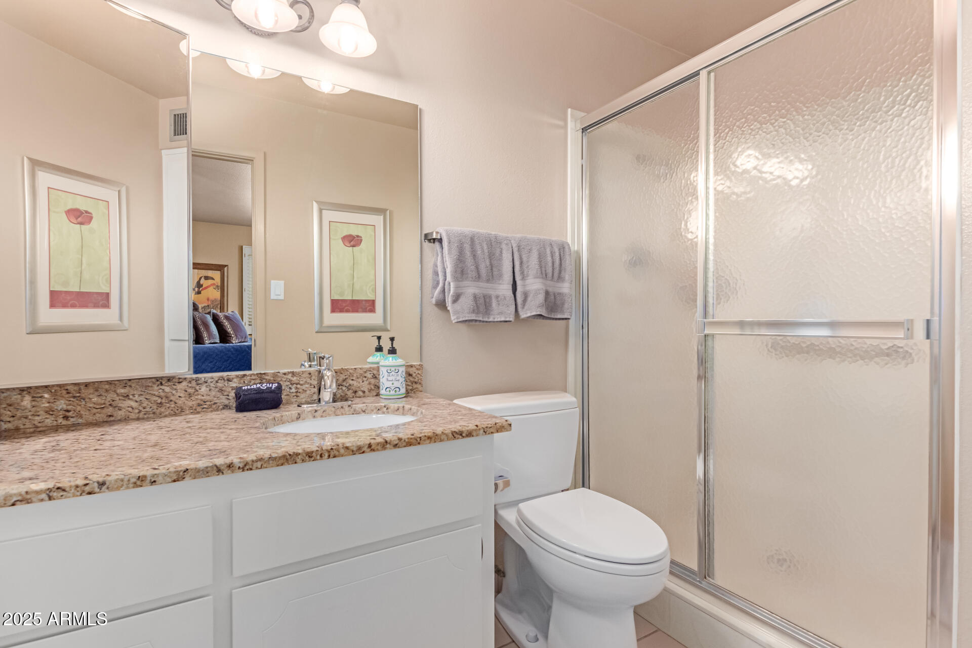 2716 South Terrace Road Tempe, AZ 85282 - Photo 15 of 32 a bathroom with a granite countertop sink toilet and shower