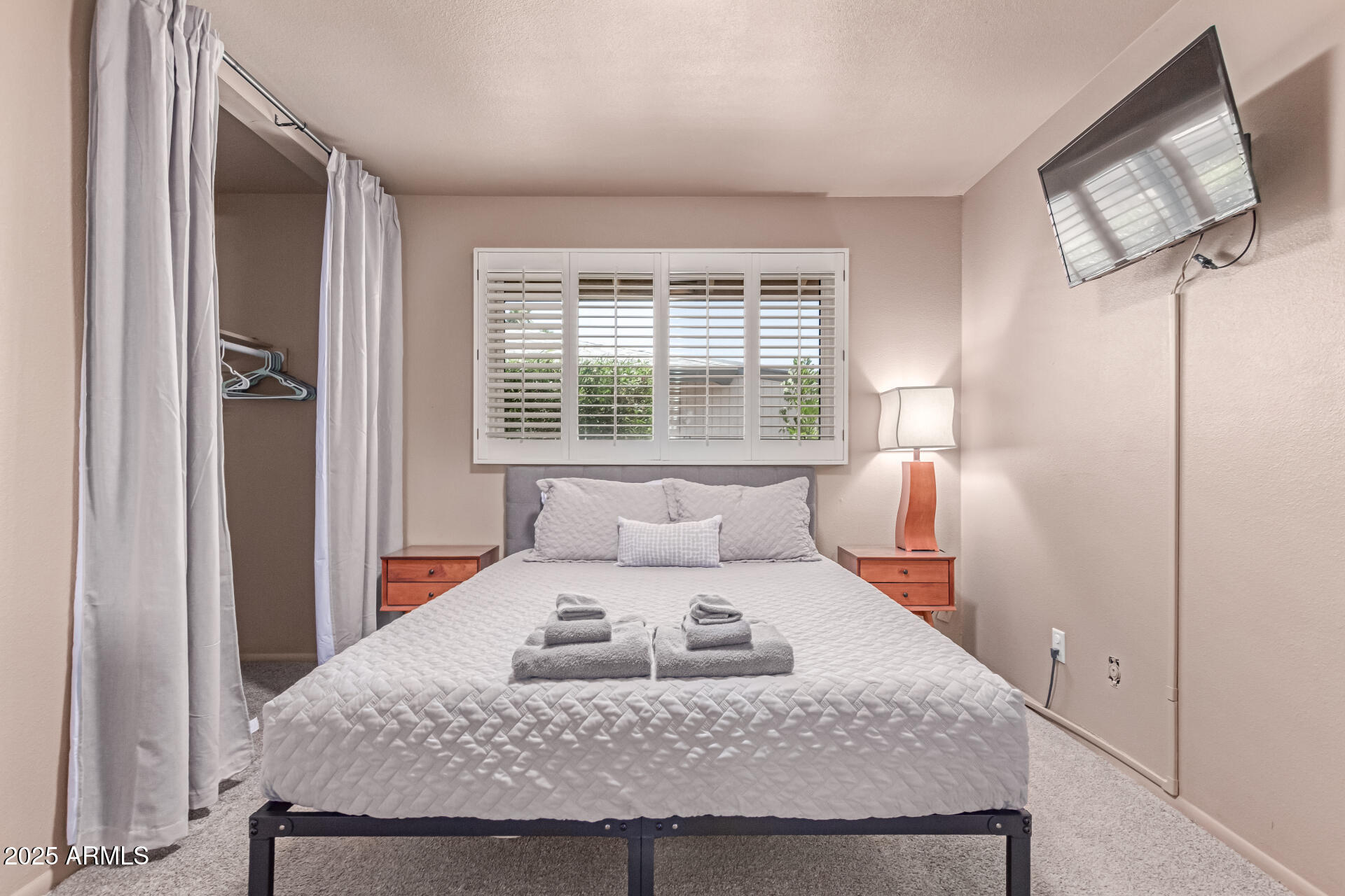 2716 South Terrace Road Tempe, AZ 85282 - Photo 16 of 32 a bedroom with a bed and wooden floor