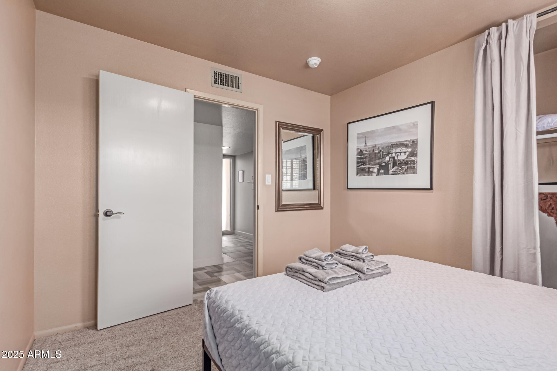 2716 South Terrace Road Tempe, AZ 85282 - Photo 17 of 32 a bedroom with a bed and a painting on the wall