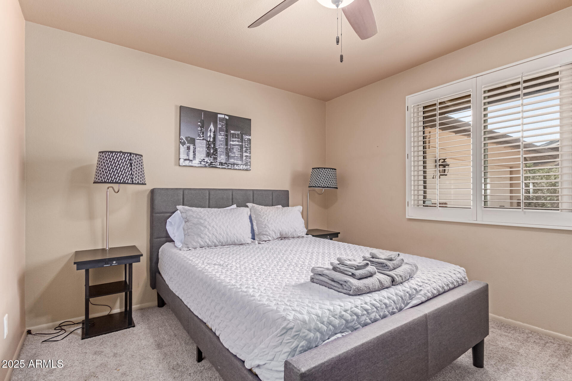 2716 South Terrace Road Tempe, AZ 85282 - Photo 18 of 32 a bedroom with a bed and a couch