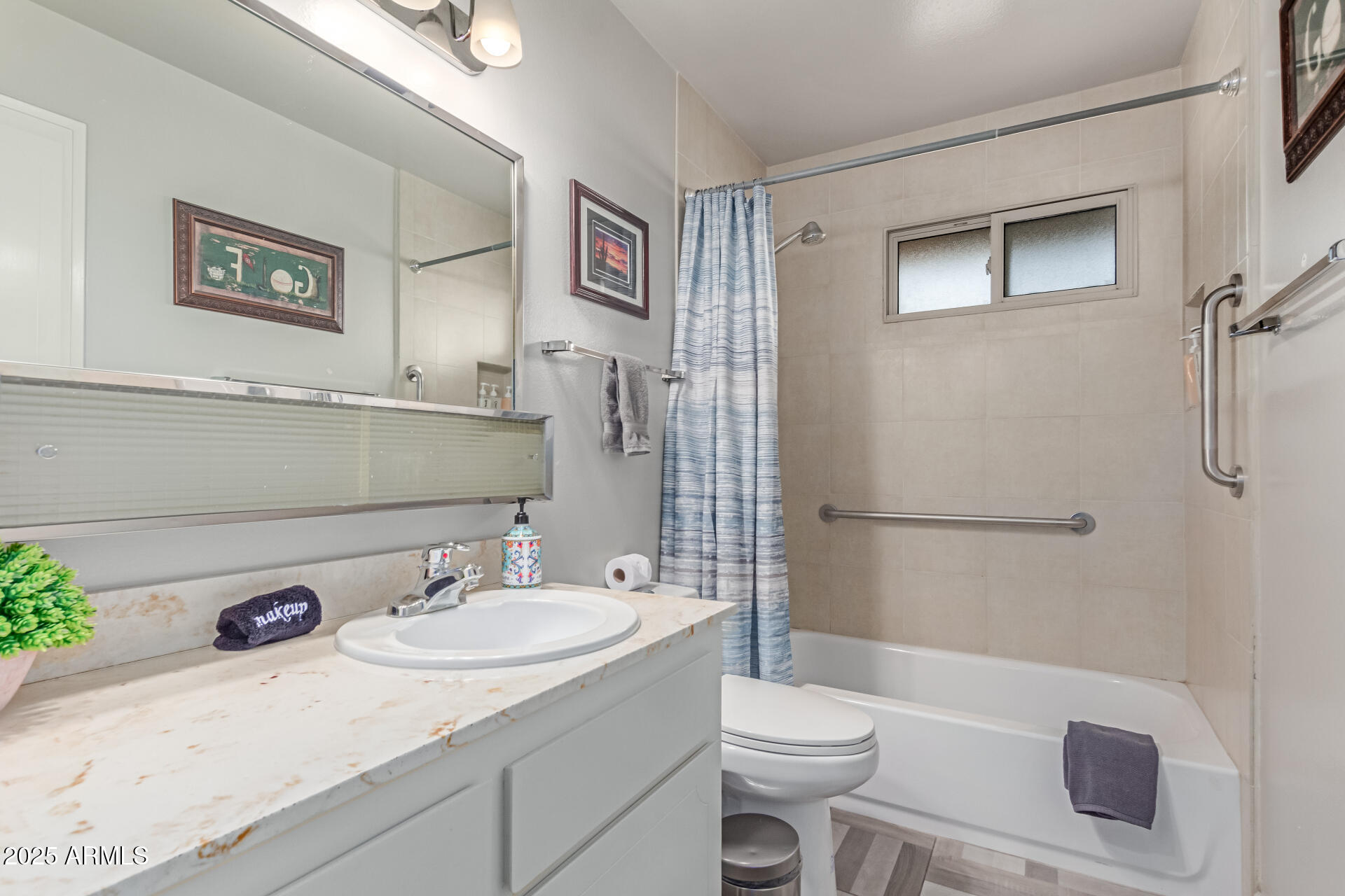 2716 South Terrace Road Tempe, AZ 85282 - Photo 25 of 32 a bathroom with a sink toilet and shower