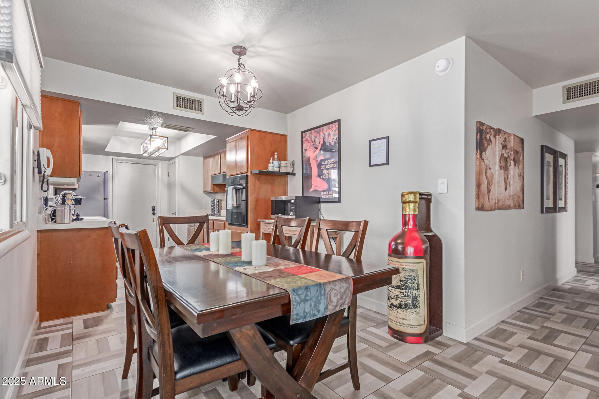 2716 South Terrace Road Tempe, AZ 85282 - Photo 7 of 32 a view of a dining room with furniture and chandelier