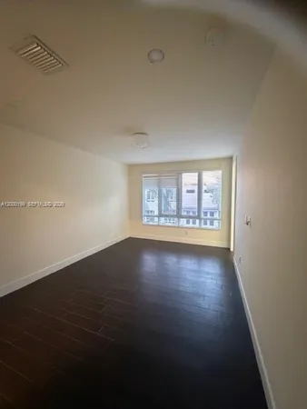 a bathroom with a tub shower a sink and mirror