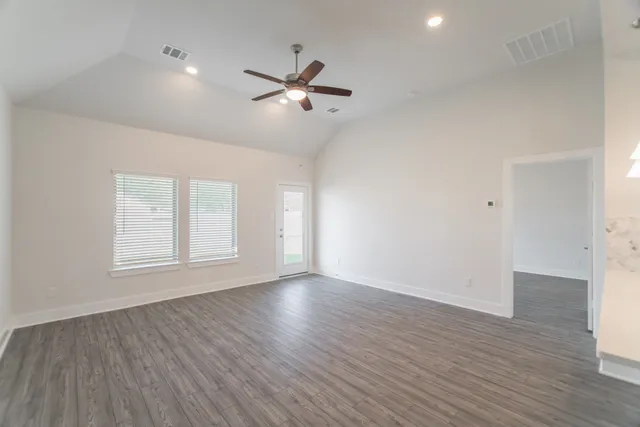 a bathroom with a double vanity sink a mirror and a bathtub