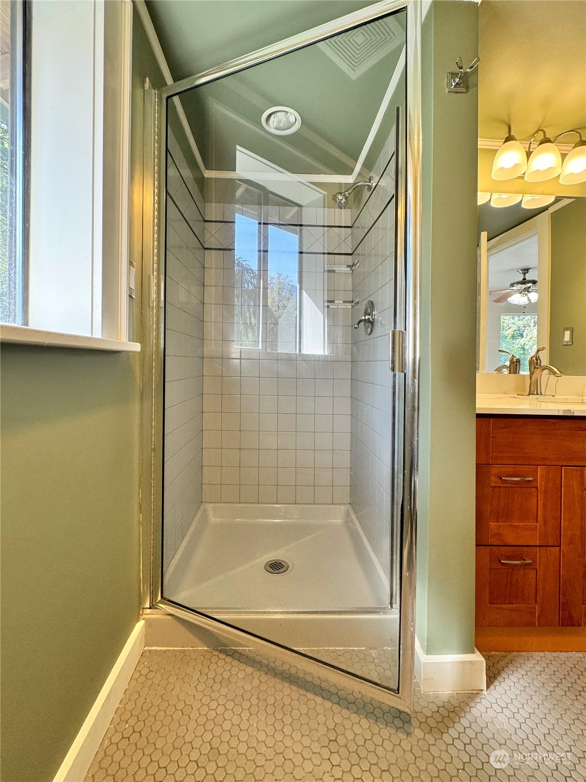 51603 South Riverside Road Gold Bar, WA 98251 - Photo 16 of 38 a bathroom with a glass shower door