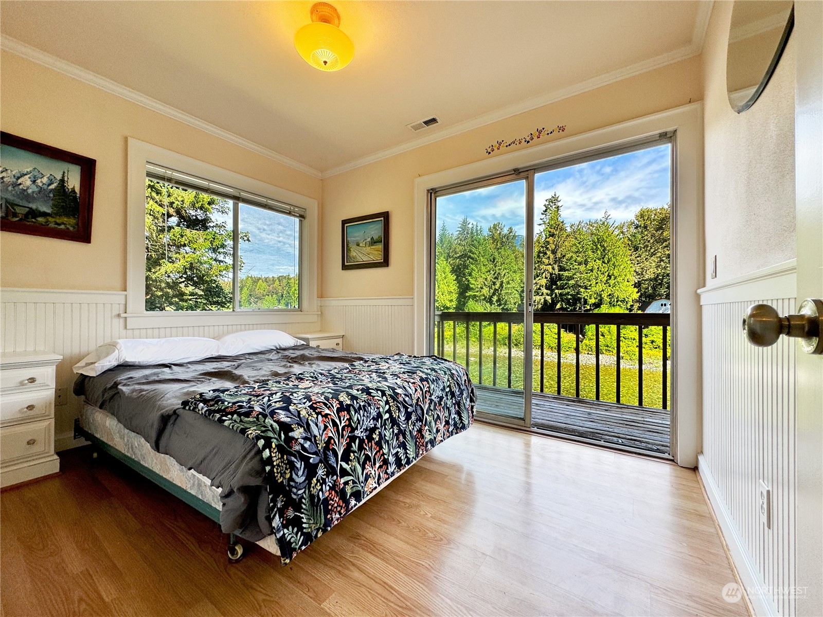 51603 South Riverside Road Gold Bar, WA 98251 - Photo 24 of 38 a bed sitting in a bedroom next to a window