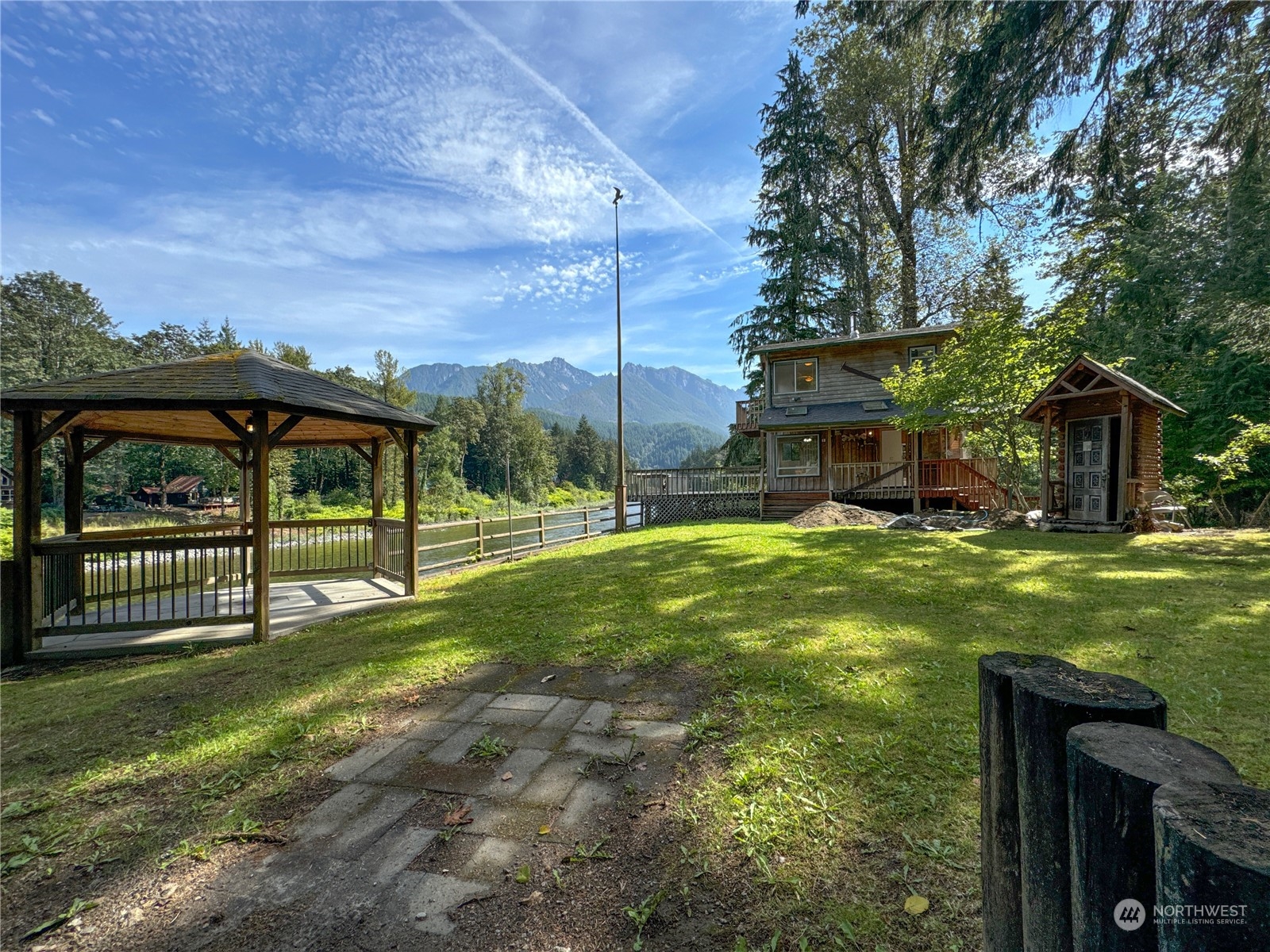 51603 South Riverside Road Gold Bar, WA 98251 - Photo 36 of 38 a view of a house with backyard and sitting area