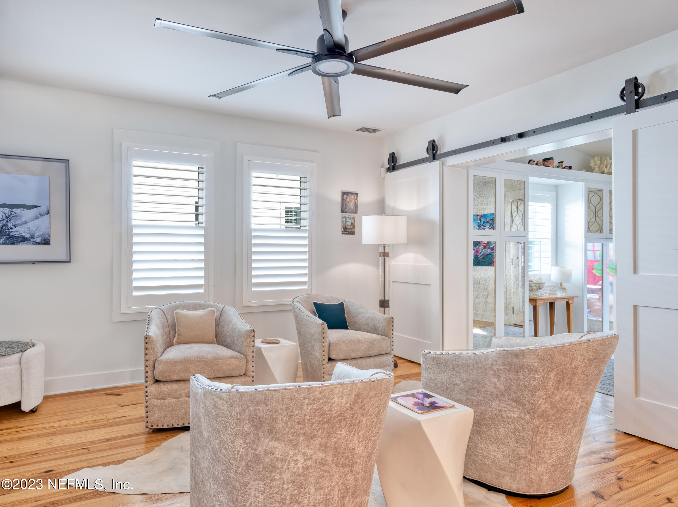 124 South 5th Street Fernandina Beach, FL 32034 - Photo 11 of 60 a living room with furniture and a large window