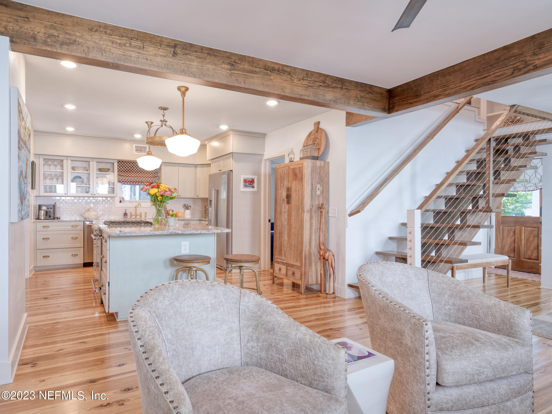 124 South 5th Street Fernandina Beach, FL 32034 - Photo 13 of 60 a living room with couches and kitchen view with wooden floor
