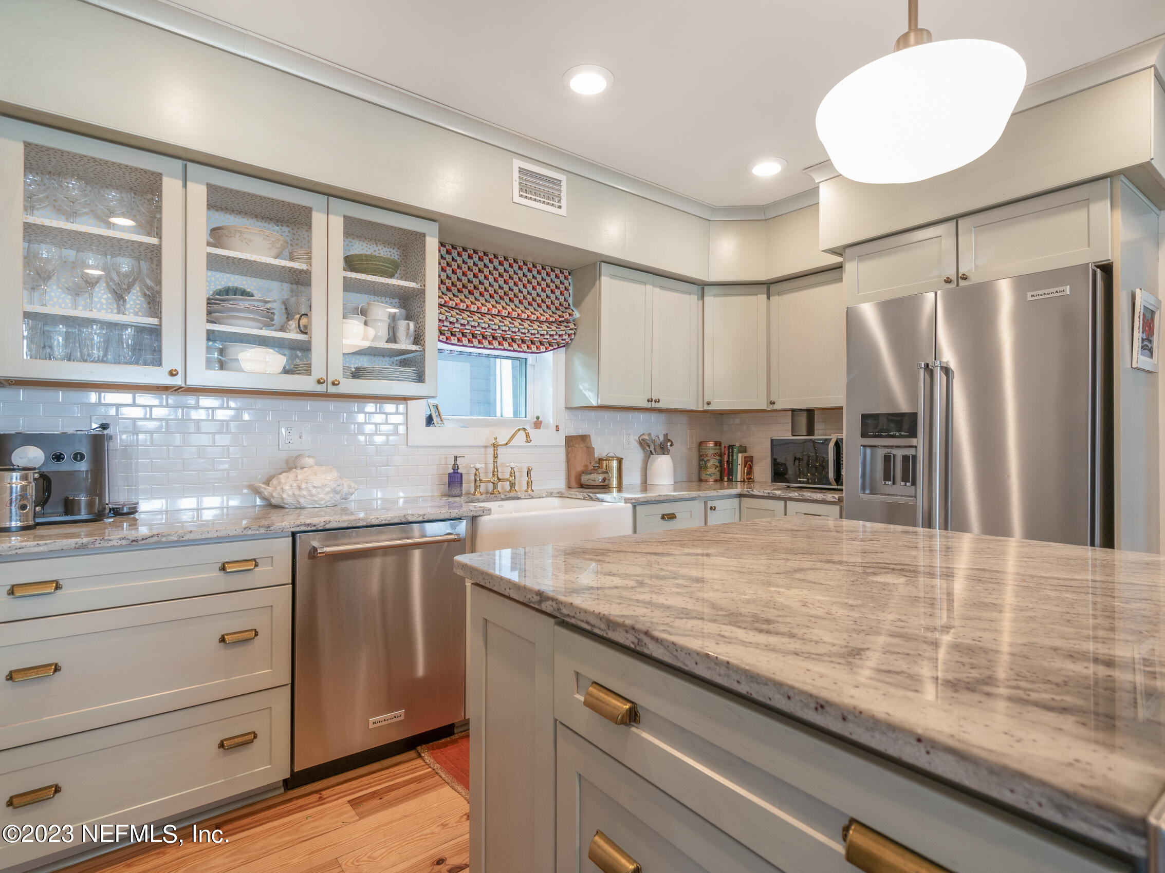 124 South 5th Street Fernandina Beach, FL 32034 - Photo 17 of 60 a kitchen with a sink stainless steel appliances and cabinets