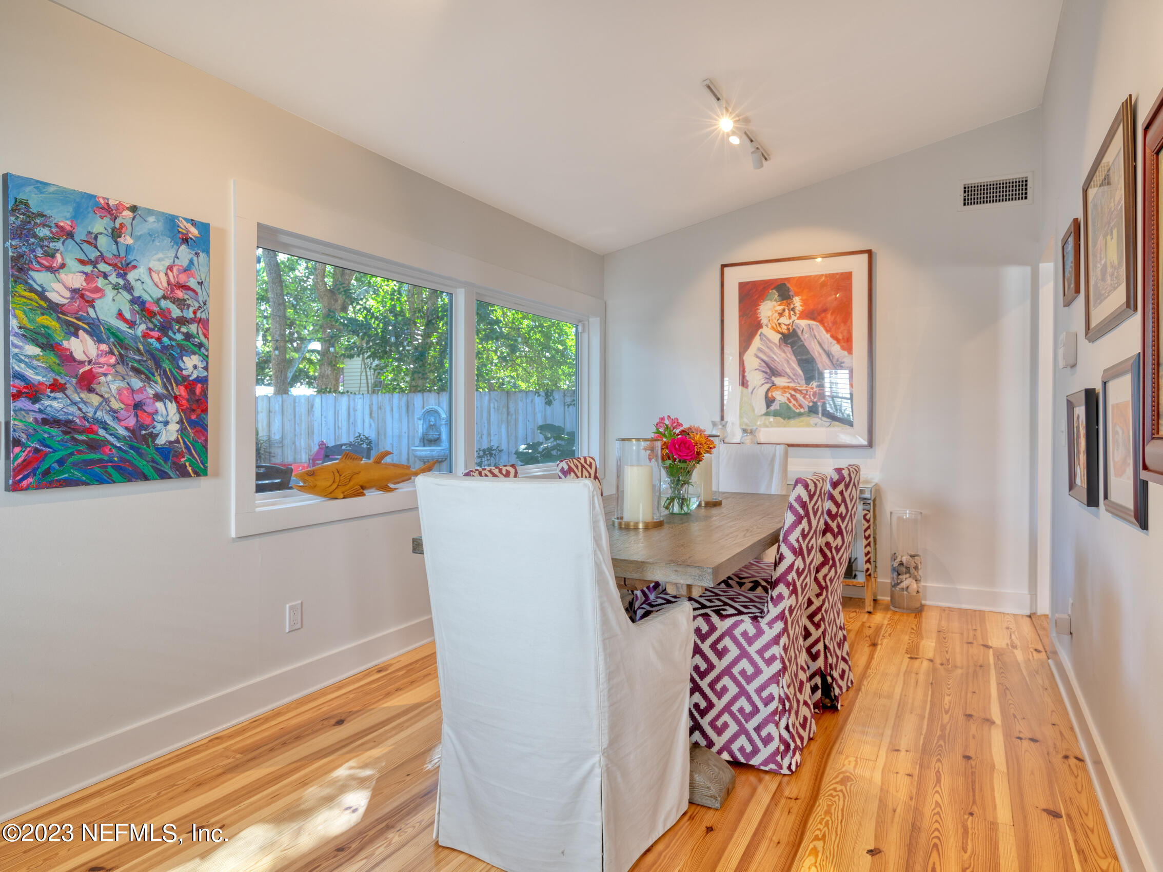 124 South 5th Street Fernandina Beach, FL 32034 - Photo 18 of 60 a dining room with furniture and a floor to ceiling window