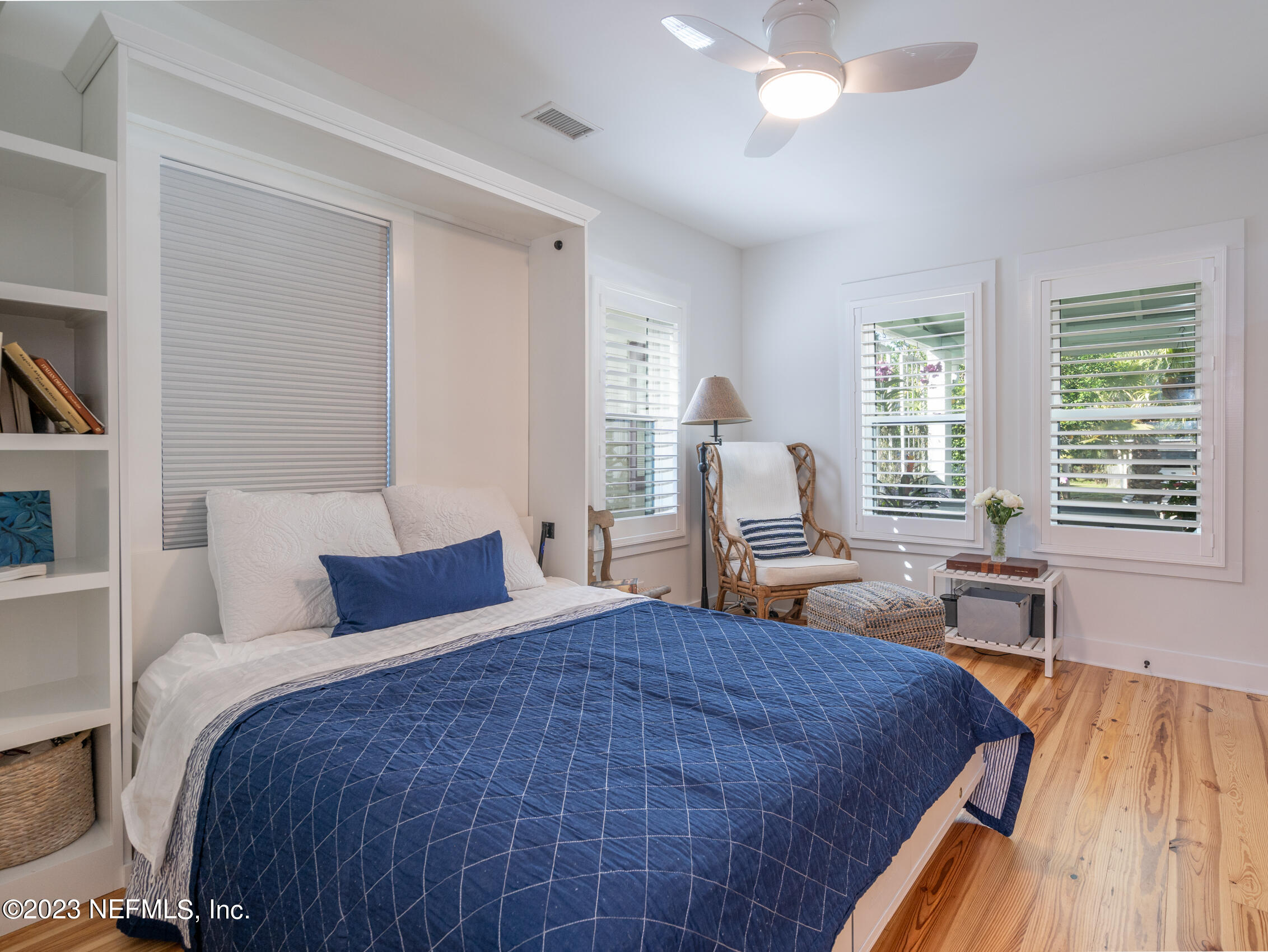 124 South 5th Street Fernandina Beach, FL 32034 - Photo 20 of 60 a bedroom with bed and a large window