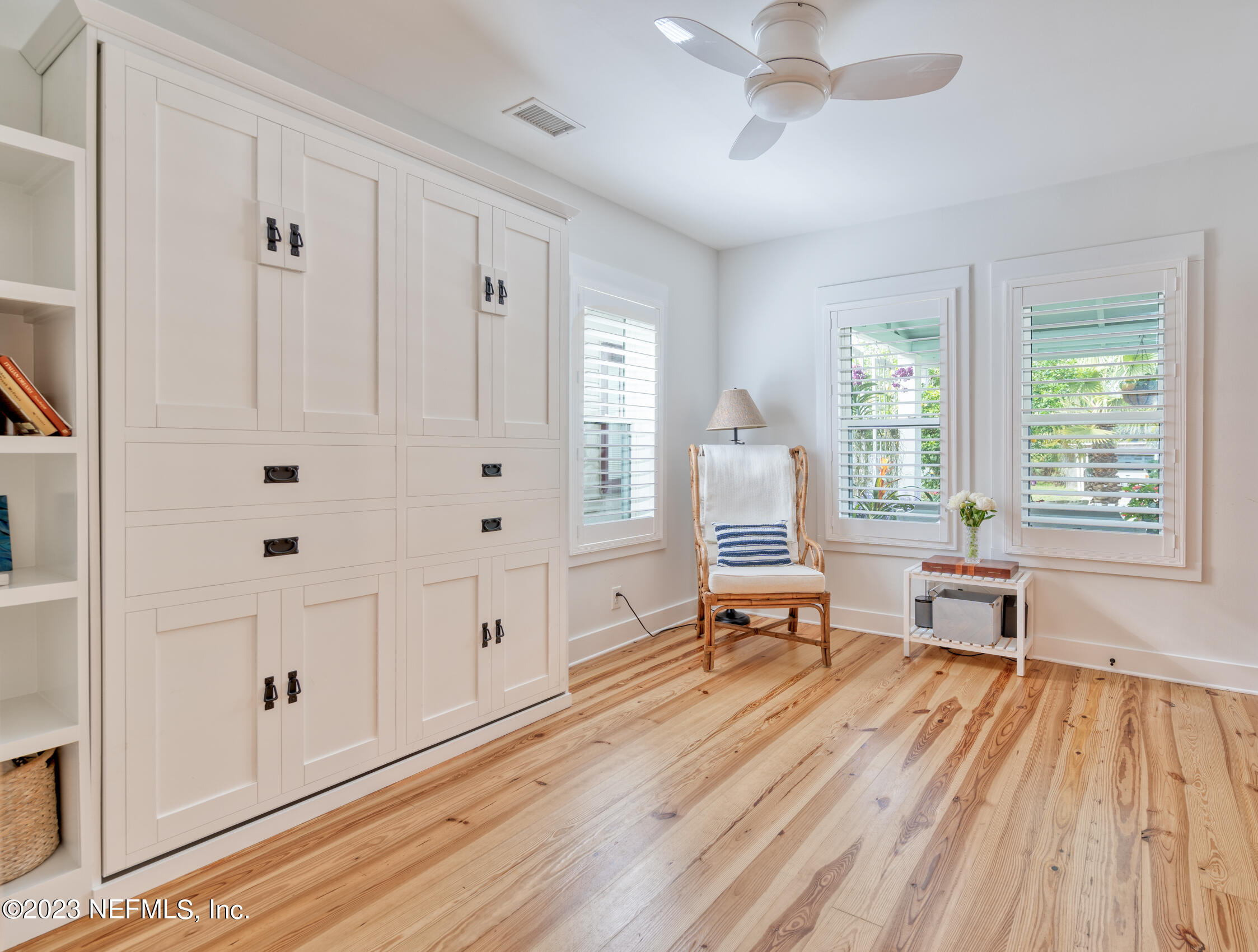 124 South 5th Street Fernandina Beach, FL 32034 - Photo 22 of 60 a living room with furniture and large windows