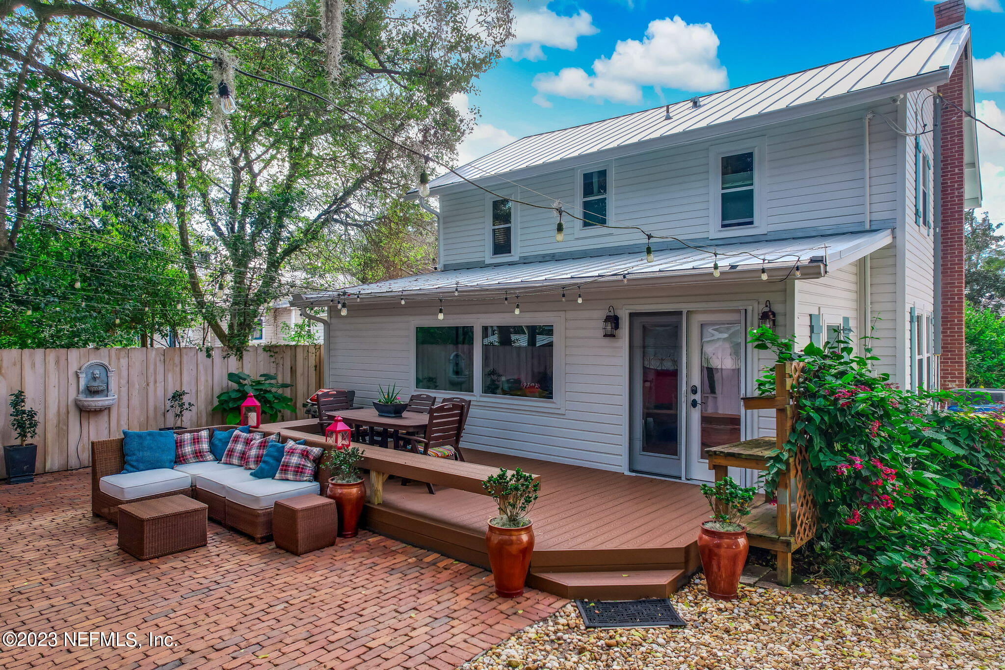 124 South 5th Street Fernandina Beach, FL 32034 - Photo 3 of 60 a outdoor living space with furniture and a fireplace