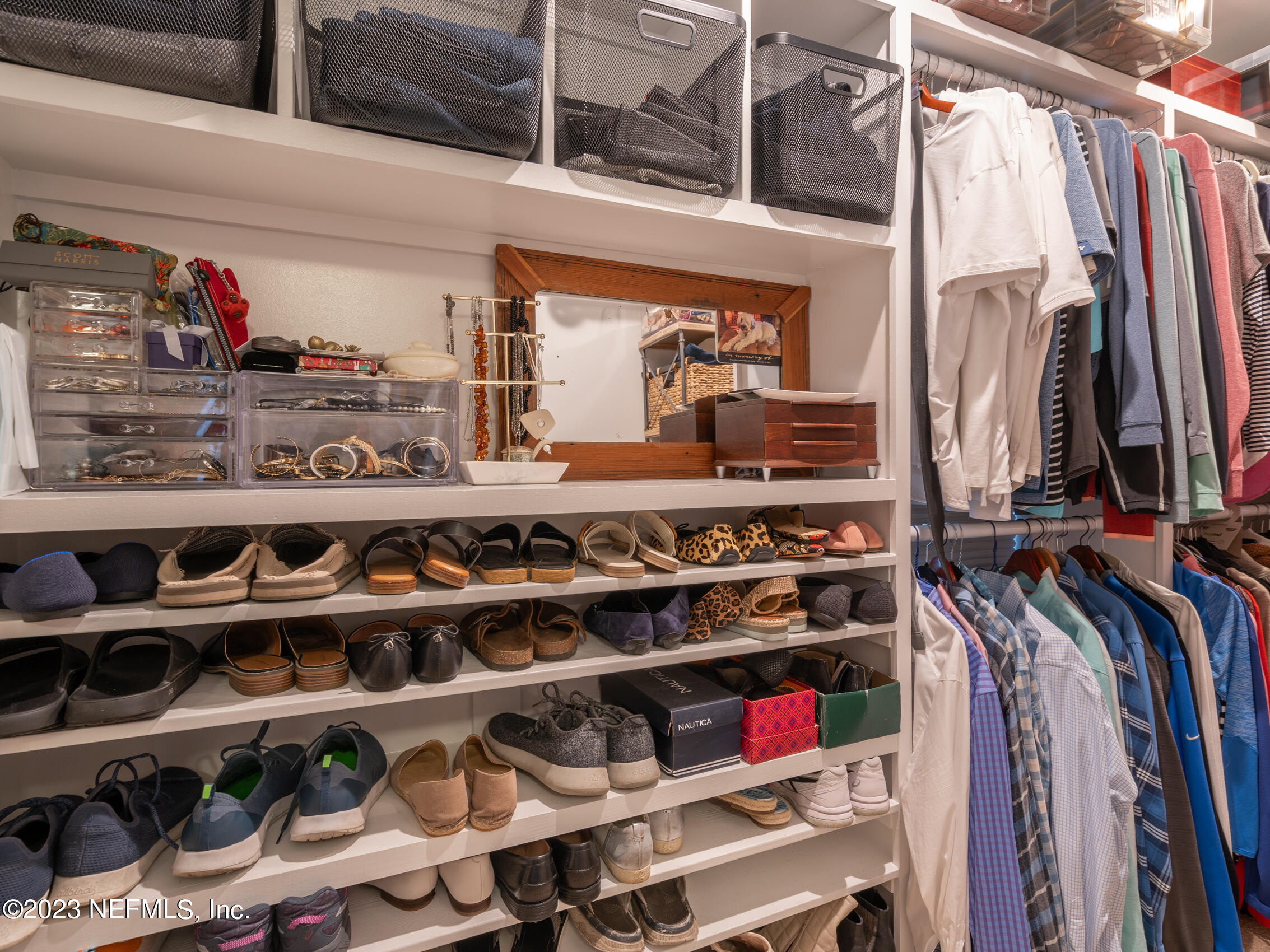 124 South 5th Street Fernandina Beach, FL 32034 - Photo 31 of 60 a view of walk in closet with clothes and shoes