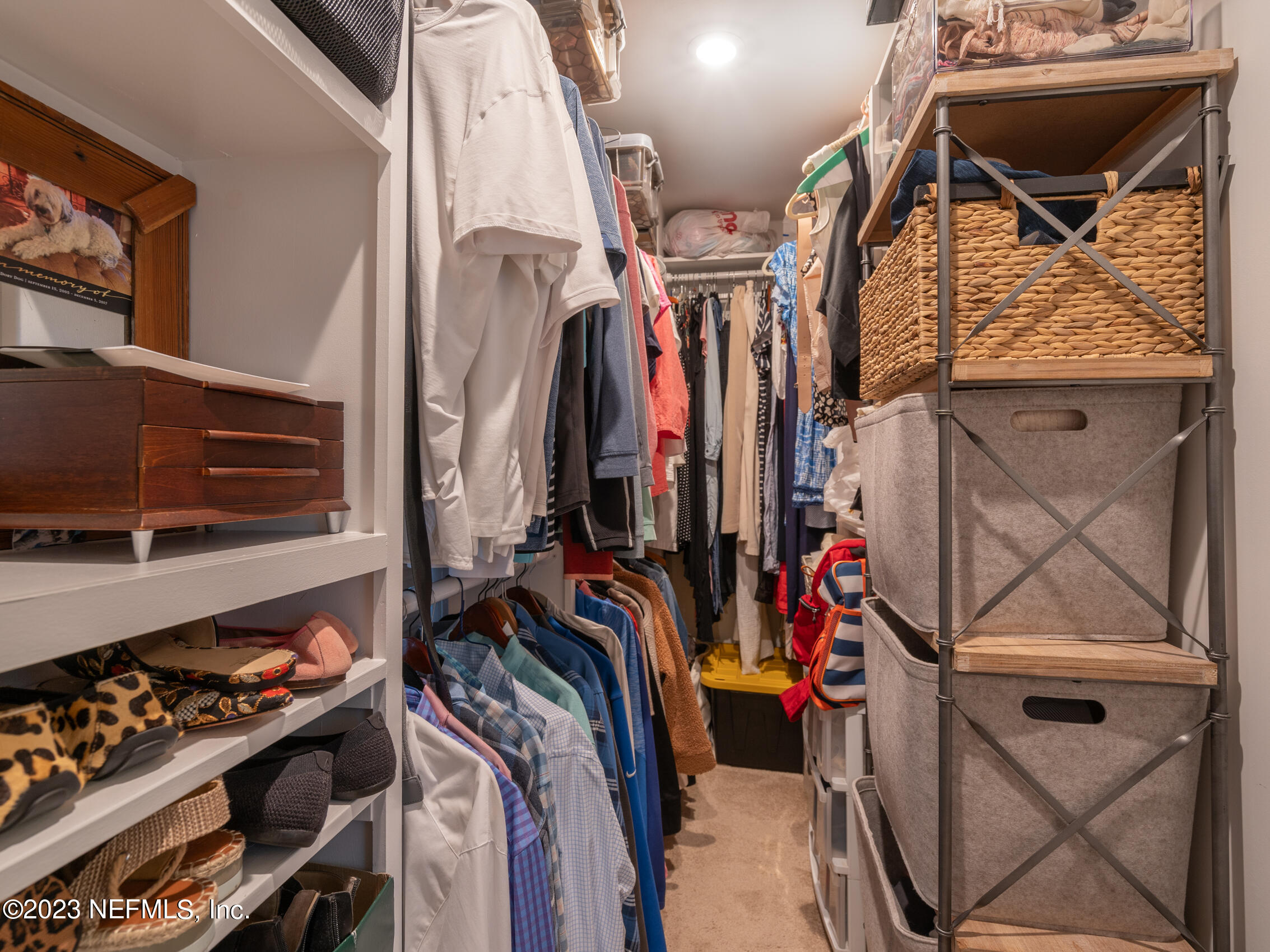 124 South 5th Street Fernandina Beach, FL 32034 - Photo 32 of 60 a view of walk in closet with clothes and shoes