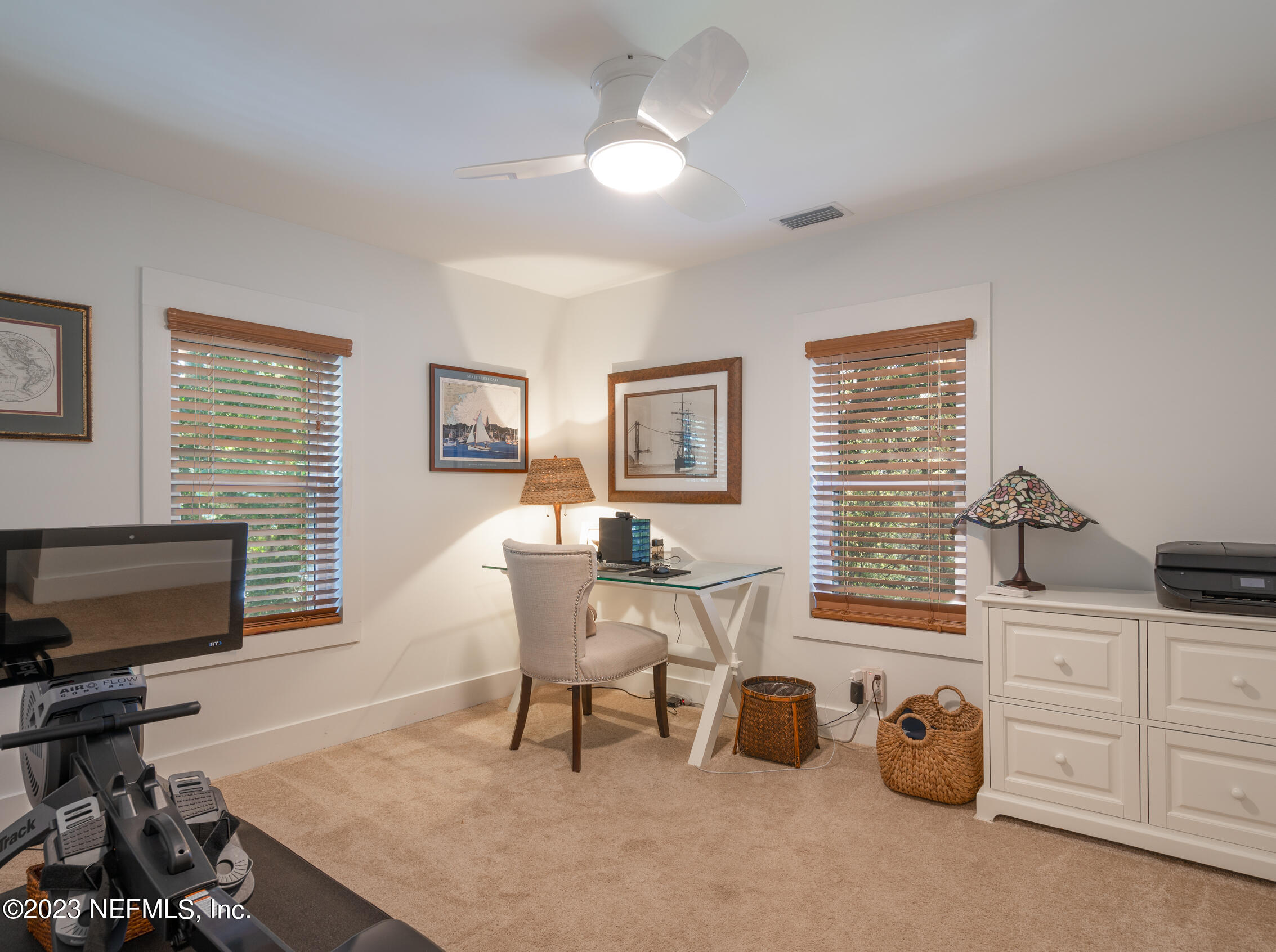124 South 5th Street Fernandina Beach, FL 32034 - Photo 33 of 60 a living room with furniture and a flat screen tv