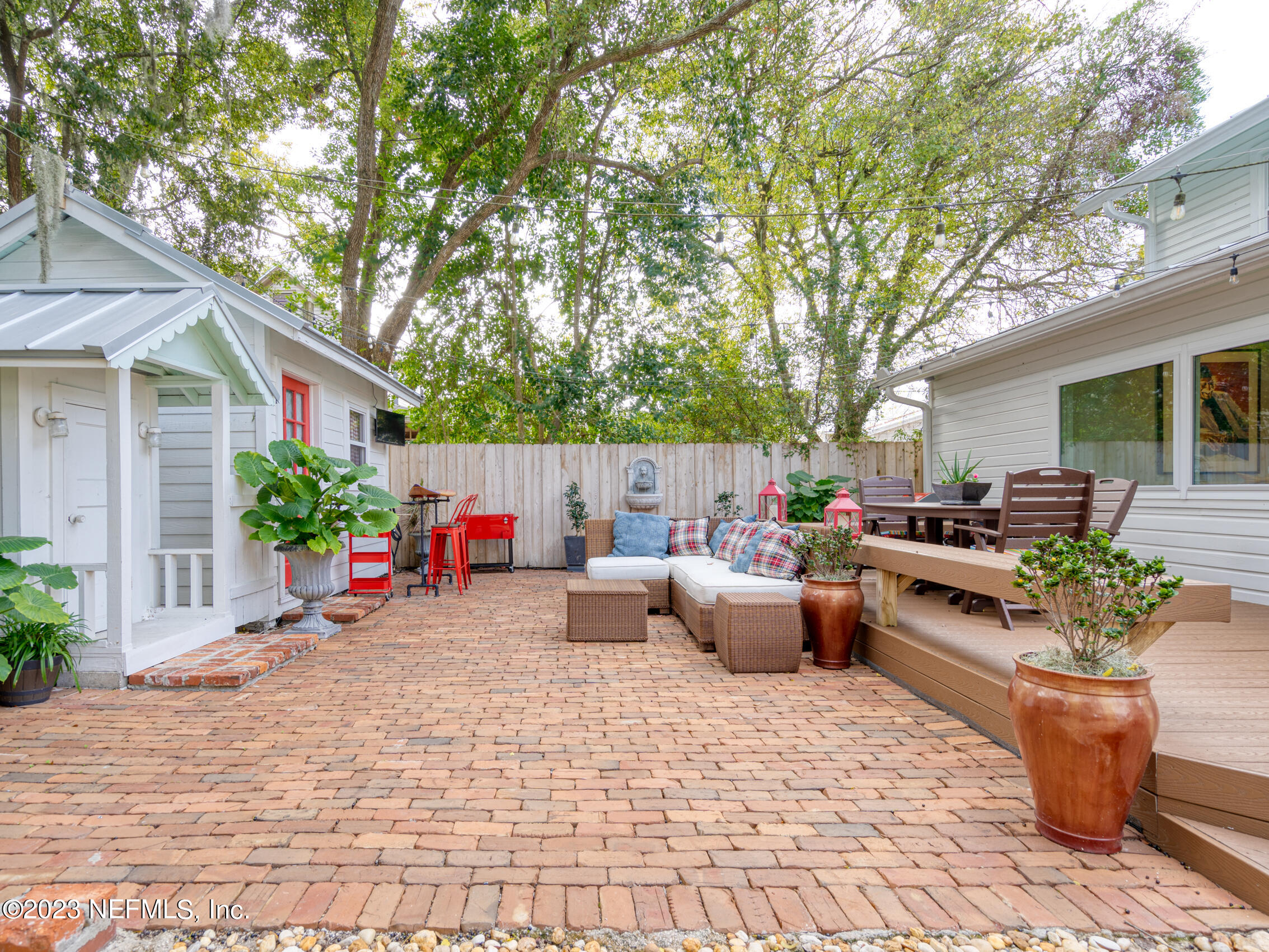 124 South 5th Street Fernandina Beach, FL 32034 - Photo 40 of 60 a view of a house with backyard and sitting area