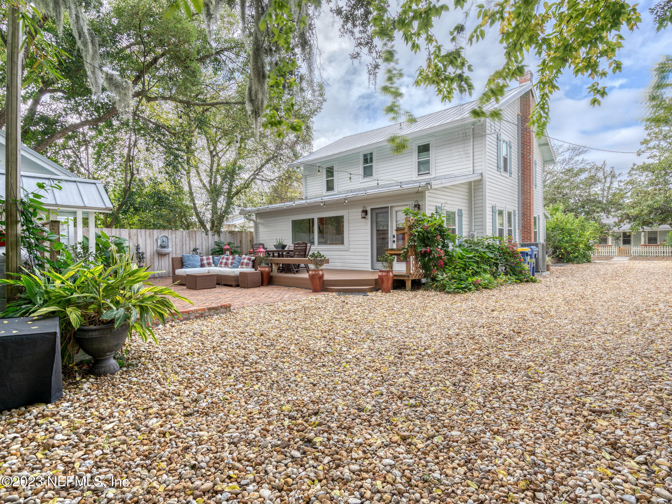 124 South 5th Street Fernandina Beach, FL 32034 - Photo 41 of 60 a view of a house with a garden