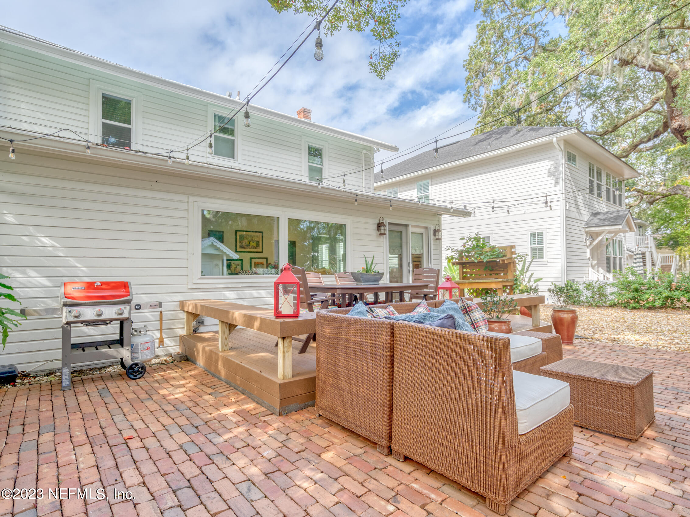 124 South 5th Street Fernandina Beach, FL 32034 - Photo 43 of 60 a living room with patio furniture and a fire pit