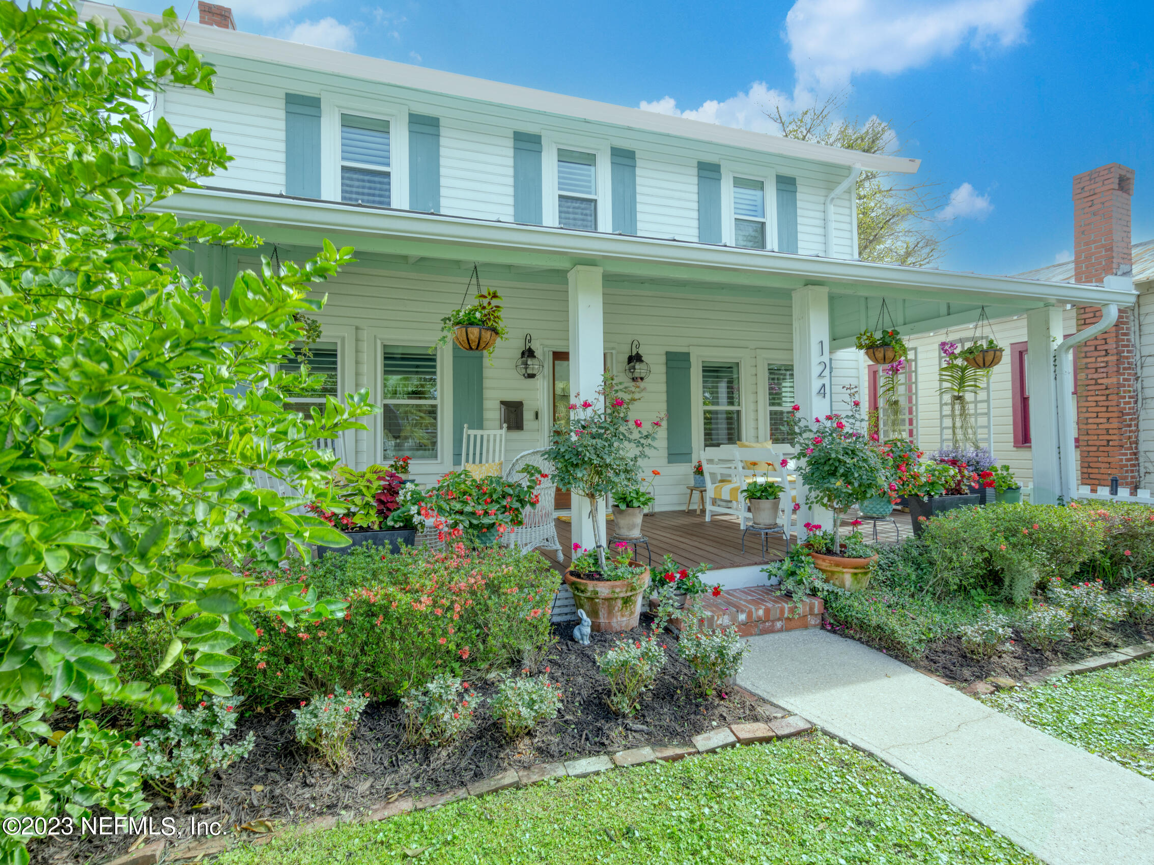 124 South 5th Street Fernandina Beach, FL 32034 - Photo 56 of 60 front view of a house with potted plants