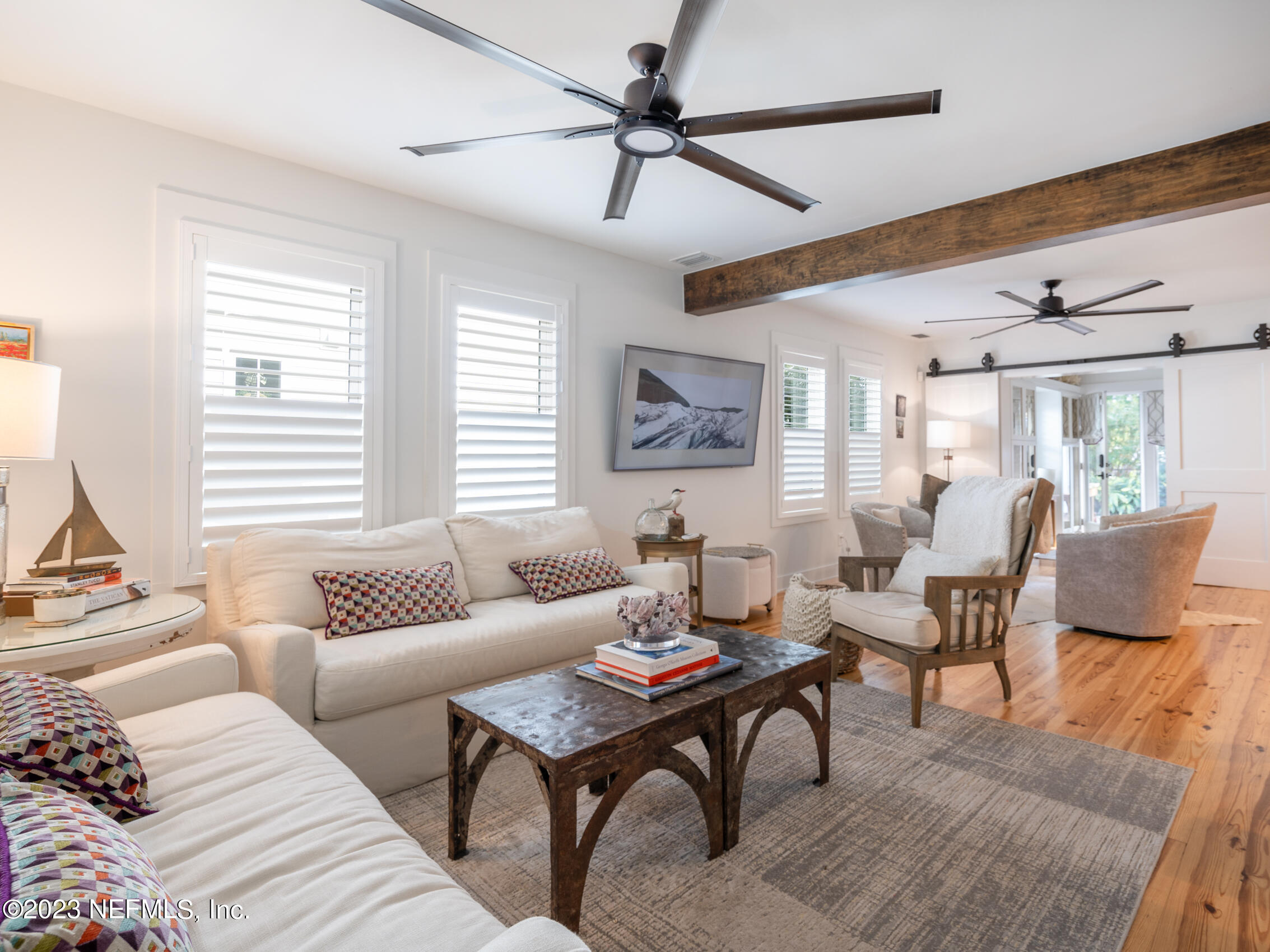 124 South 5th Street Fernandina Beach, FL 32034 - Photo 7 of 60 a living room with furniture and a large window