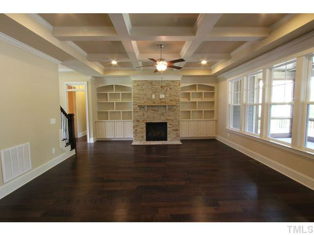 3208 Bryant Falls Court Raleigh, NC 27613 - Photo 2 of 25 a view of an empty room with a fireplace and a window