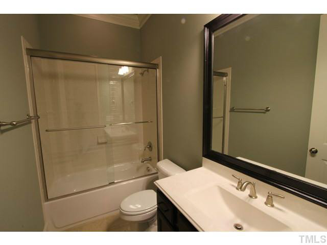 3208 Bryant Falls Court Raleigh, NC 27613 - Photo 19 of 25 a bathroom with a sink a toilet and shower