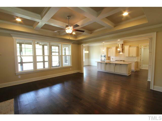 3208 Bryant Falls Court Raleigh, NC 27613 - Photo 3 of 25 a view of an empty room with window and wooden floor