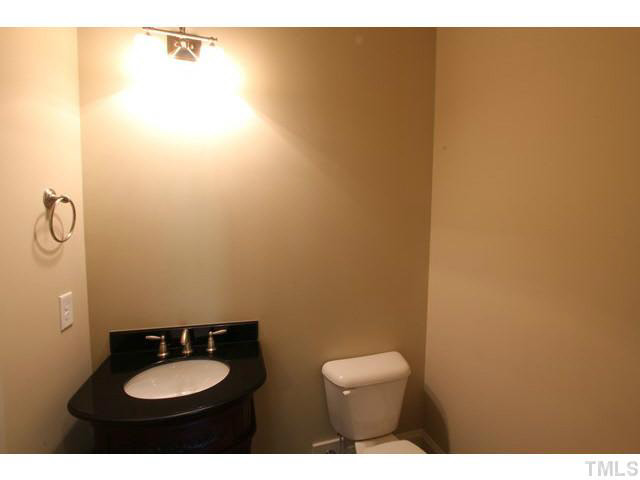 3208 Bryant Falls Court Raleigh, NC 27613 - Photo 21 of 25 a bathroom with a sink and a mirror