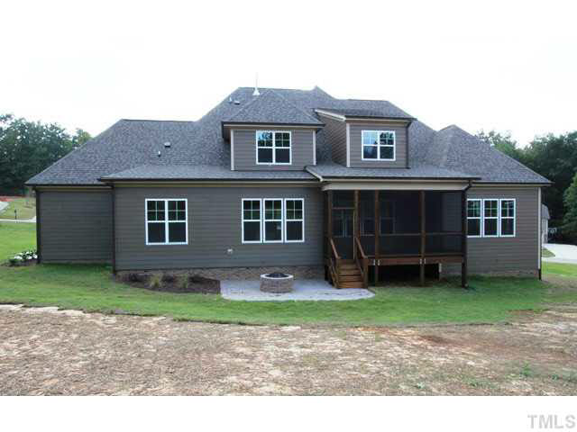 3208 Bryant Falls Court Raleigh, NC 27613 - Photo 25 of 25 a front view of a house with a garden and yard