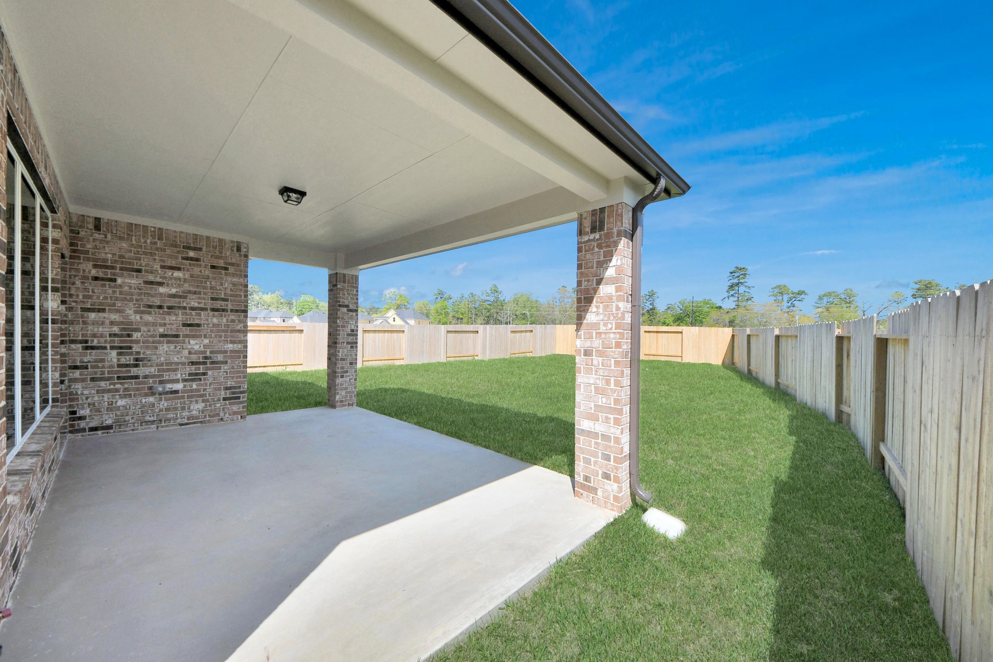 3042 Native Spg Drive Spring, TX 77373 - Photo 32 of 32 Experience outdoor living at its finest on this expansive covered patio, thoughtfully designed for BBQs and delightful outdoor dining. Sample photo of completed home with similar floor plan. Actual colors and selections may vary.