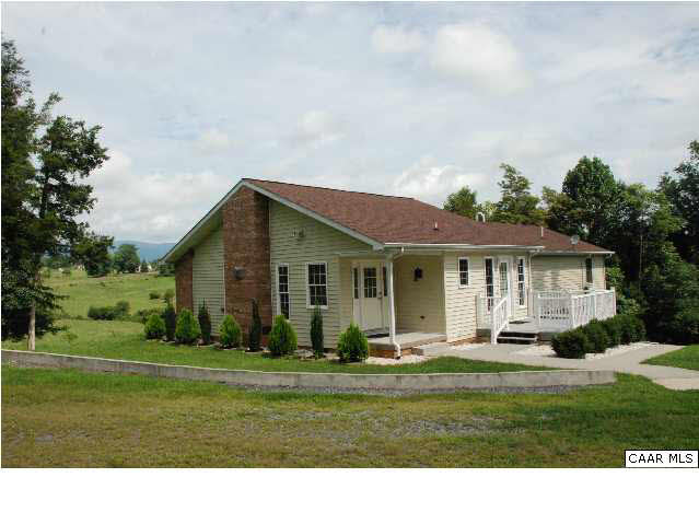 5945 South River Road Stanardsville, VA 22973 - Photo 16 of 16 Side view of the house with the mountains in the background