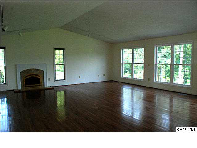 Great room was designed to accommodate a large sofa sectional and large screen tv.