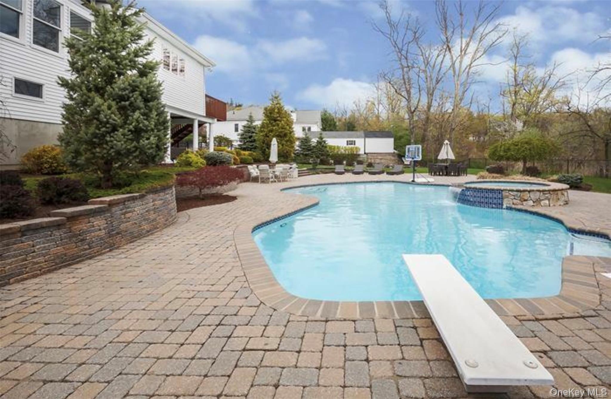 6 Dunderberg Road Tomkins Cove, NY 10986 - Photo 2 of 2 a view of a swimming pool with sitting area