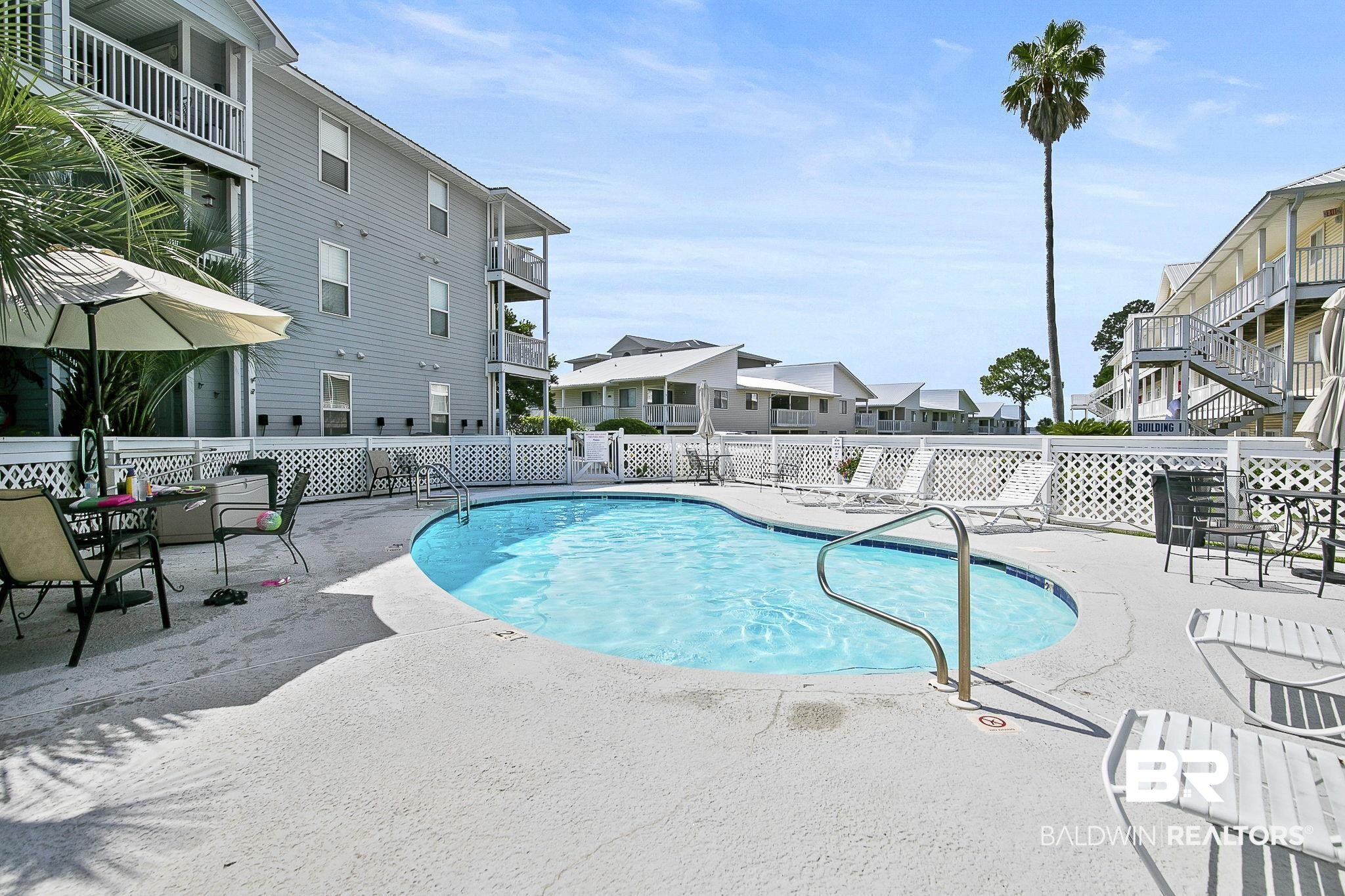 25957 Canal Road, Unit 302 Orange Beach, AL 36561 - Photo 19 of 26 View of swimming pool with a patio area