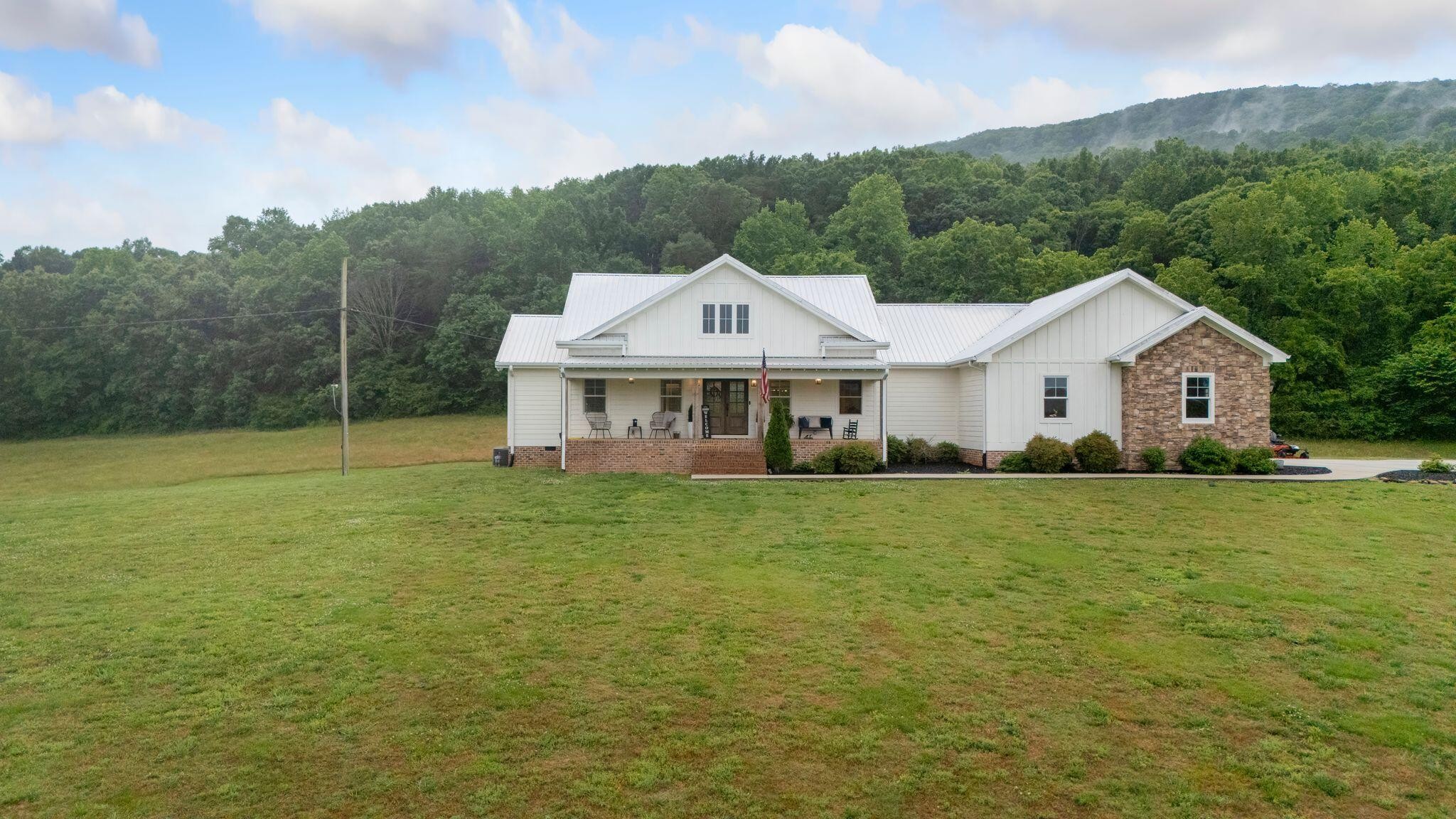 6866 Daus Mountain Road Whitwell, TN 37397 - Photo 44 of 49 a front view of a house with a garden