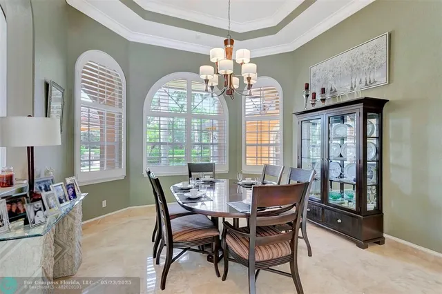 a kitchen with a sink a counter top space and a wooden floor