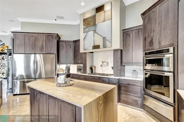a living room with furniture and a glass door