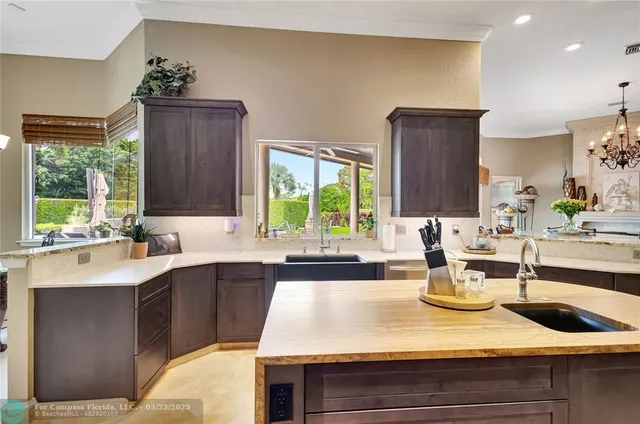 a bathroom with a granite countertop sink a toilet and a mirror