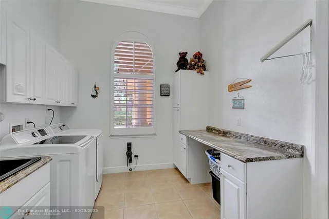 a view of a backyard with a patio and fire pit