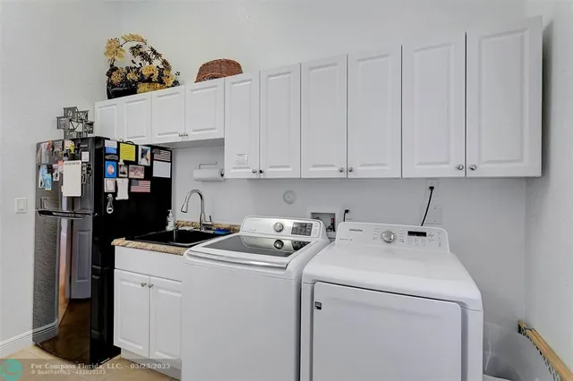 a view of a backyard with a patio and entertaining space