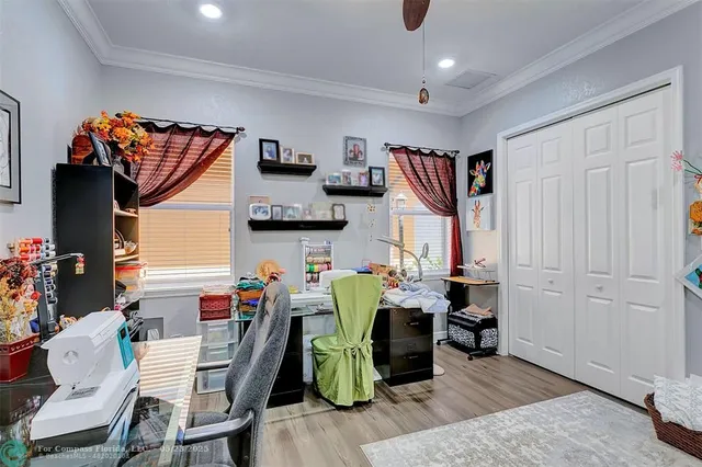 a bathroom with a granite countertop sink toilet a mirror and shower curtain