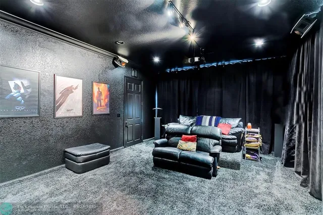 a bathroom with a granite countertop sink vanity mirror and toilet